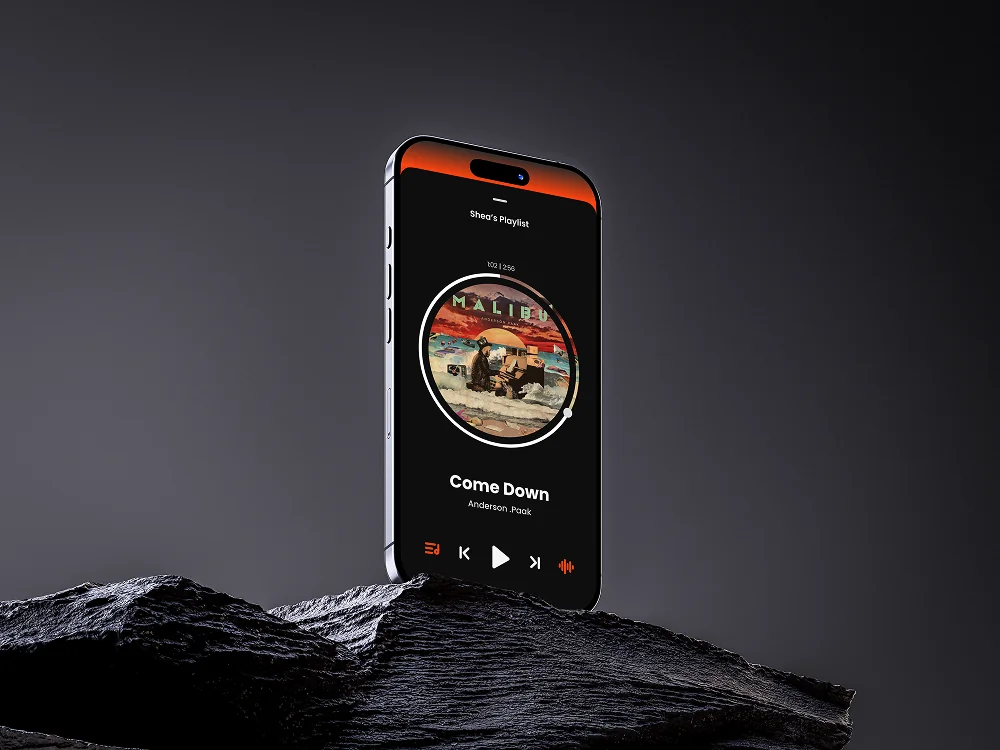 Amp now playing on a phone standing on dark rock, the album art in a circle with a progress ring
