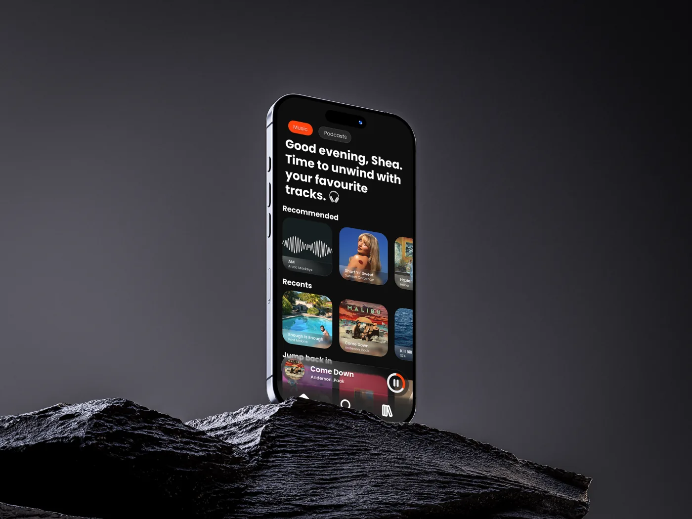 Amp music player on a phone standing on dark rock